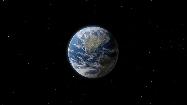 Earth as a small blue and white globe in black space