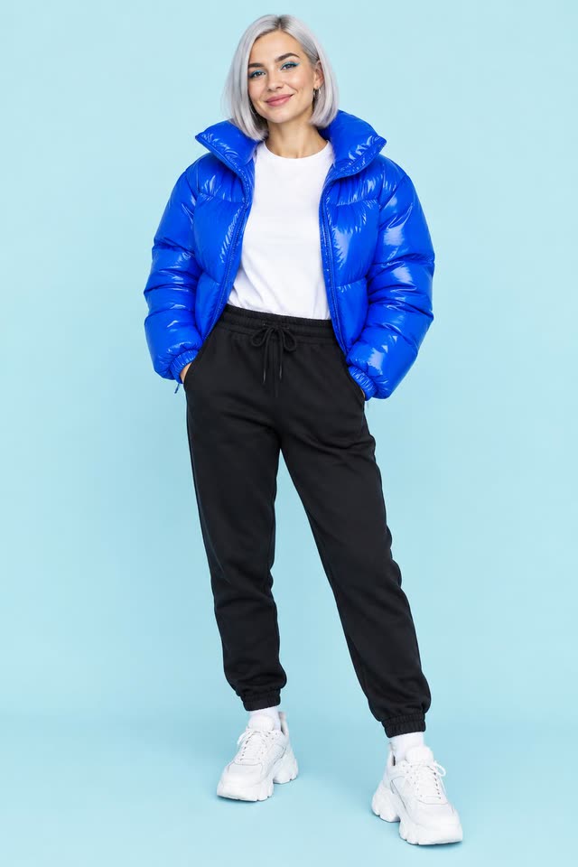Nova, a woman with a silver bob and an electric blue puffer jacket